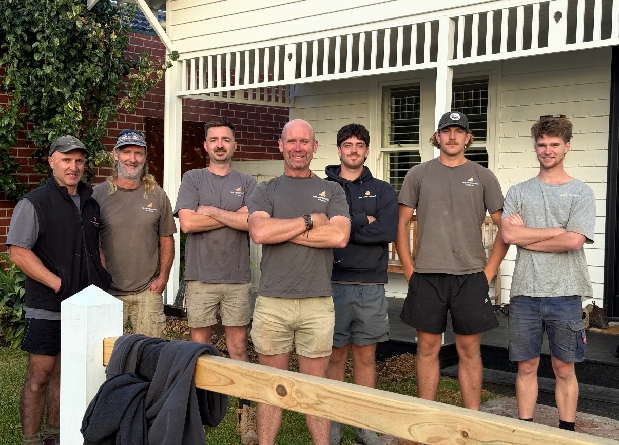 The PJR Landscaping & Design team standing together on a completed job site in Melbourne
